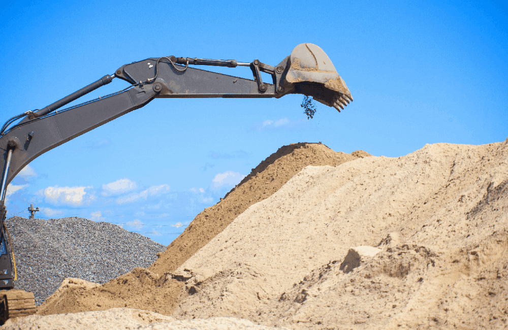 A large construction excavator of yellow color on the construction site in a quarry for quarrying<br />
